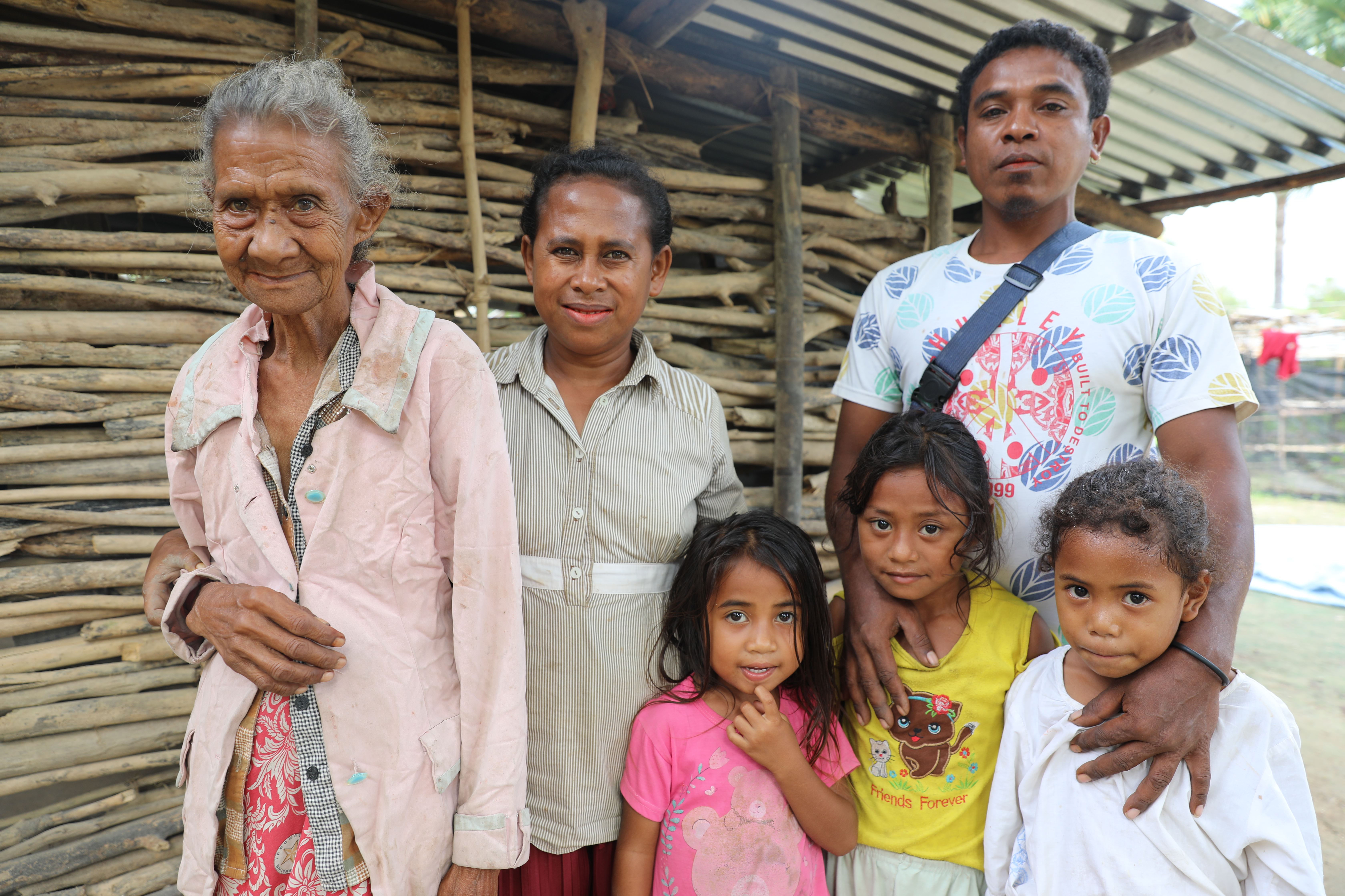 Yuliana with her mother and family